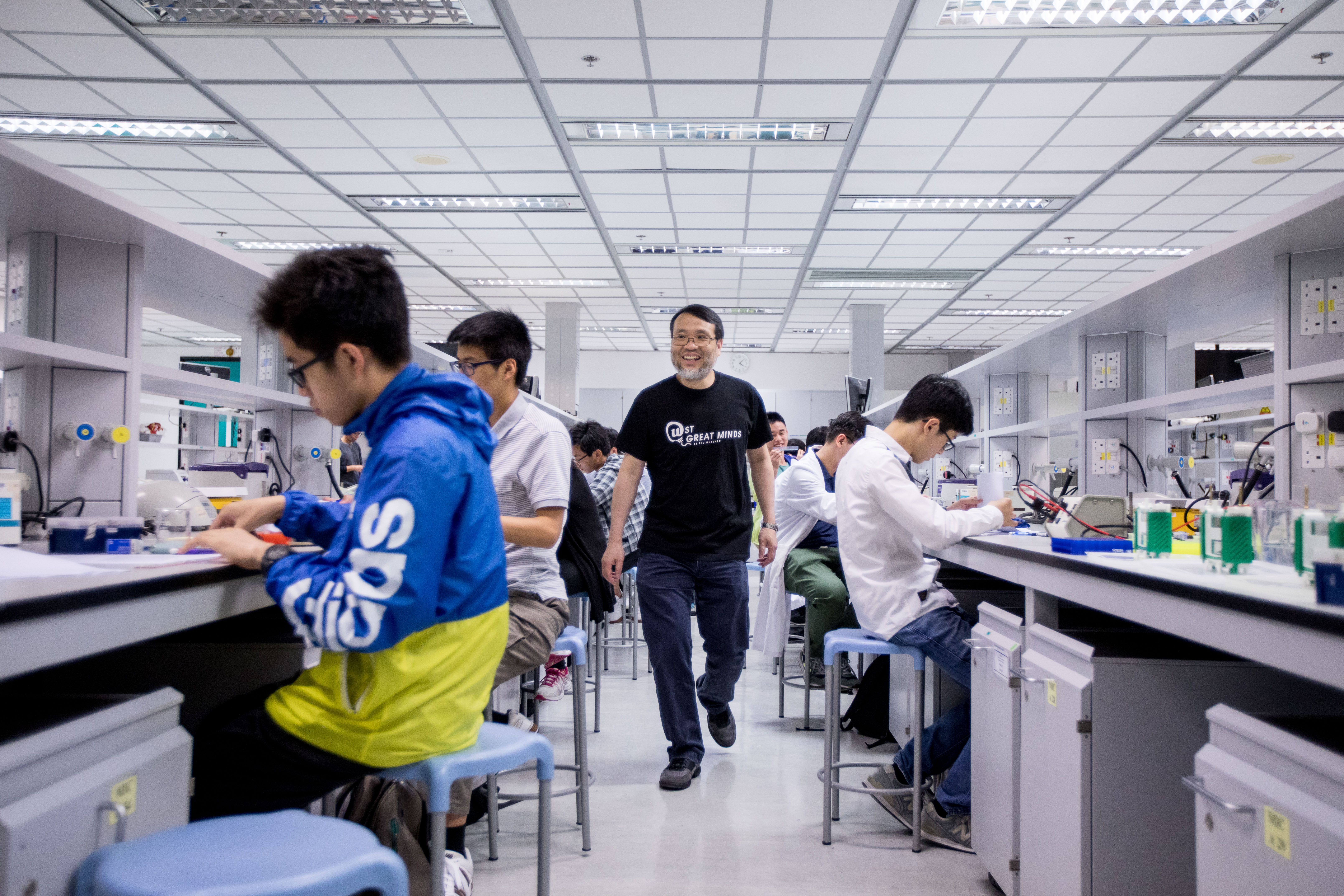 Prof. King Chow (Middle) wants to change the way biology is being taught and perceived in local schools by bringing in the International Biology Olympiad.