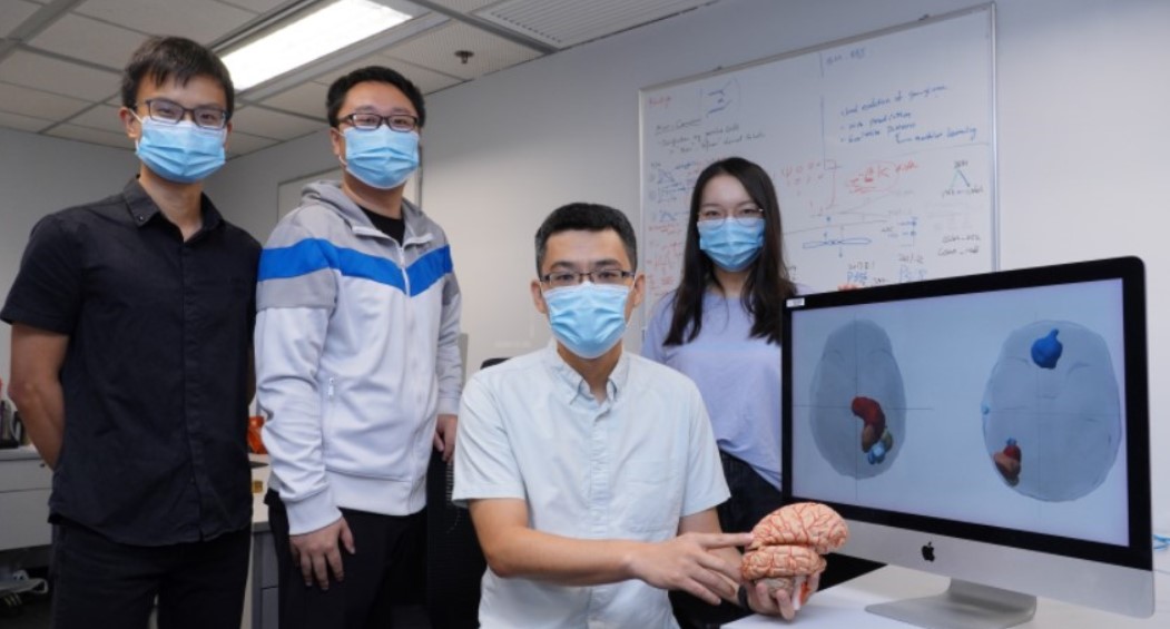 Prof. WANG Jiguang (second right) and his research team members