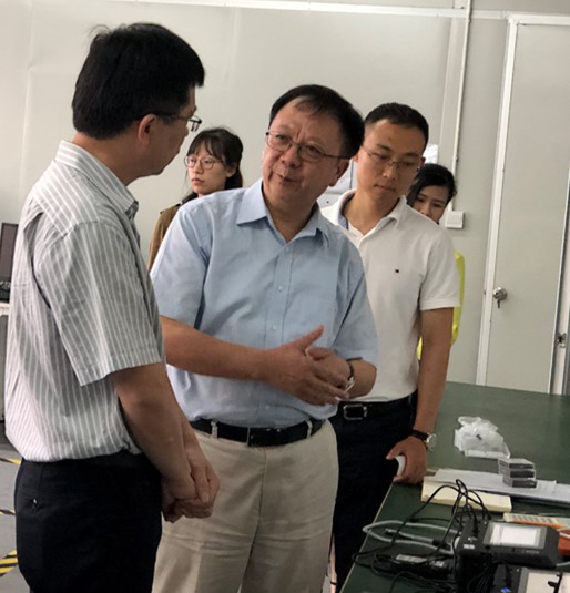 Prof. Wen (Middle) and Dr. Gao (right) introduce the theories behind their novel detection device in their research base at Shenzhen.