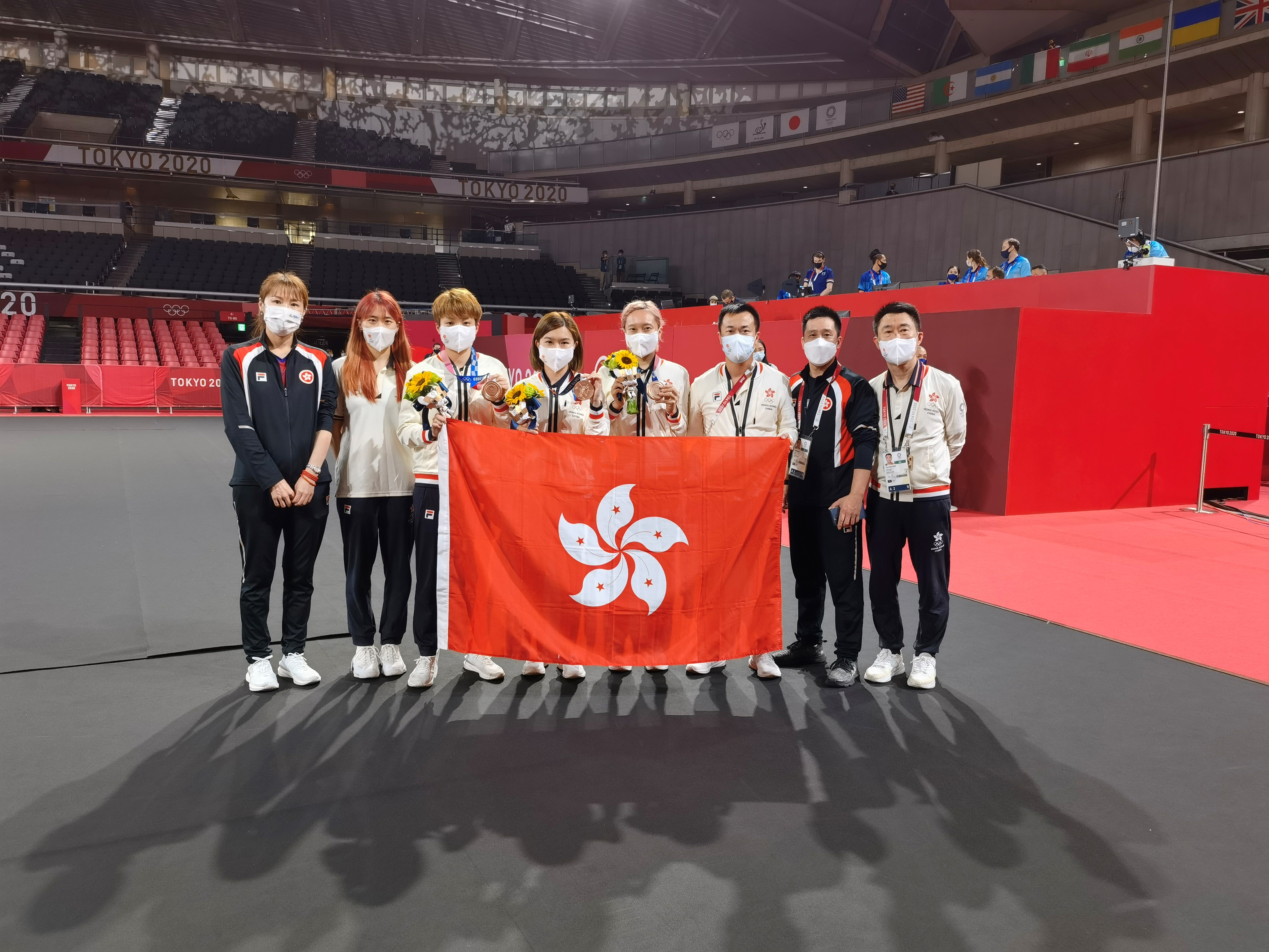 Minnie Soo (fourth right) and her teammates Lee Ho-Ching (fourth left) and Doo Hoi-Kem (third left) win bronze in the Table Tennis Women’s Team competition of the Tokyo 2020 Olympic Games.